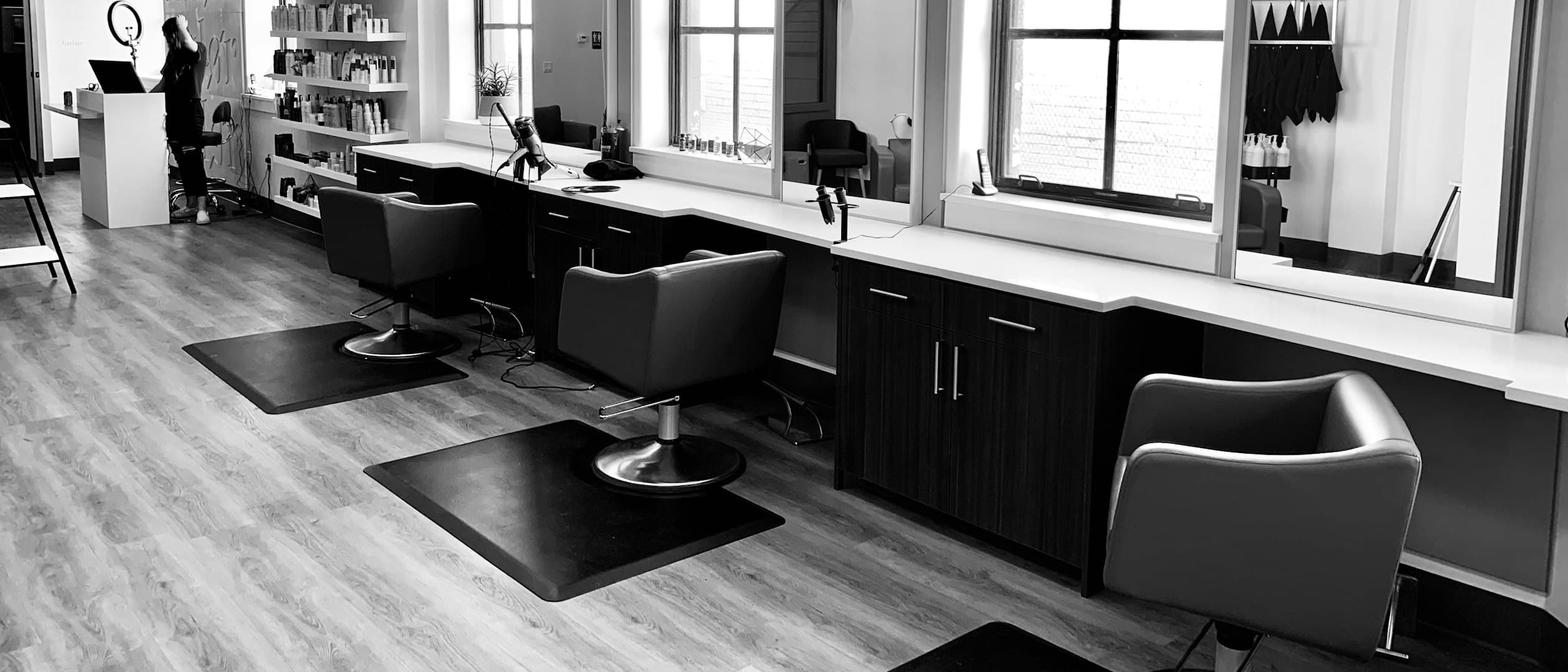 A black and white view of a hair salon